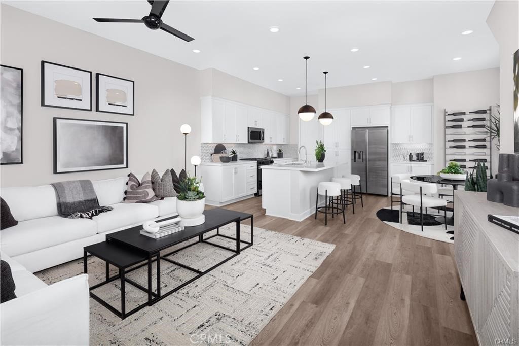242 Solaro Court Walnut, CA 91789 - Photo 2 of 15 a living room with furniture and a wooden floor
