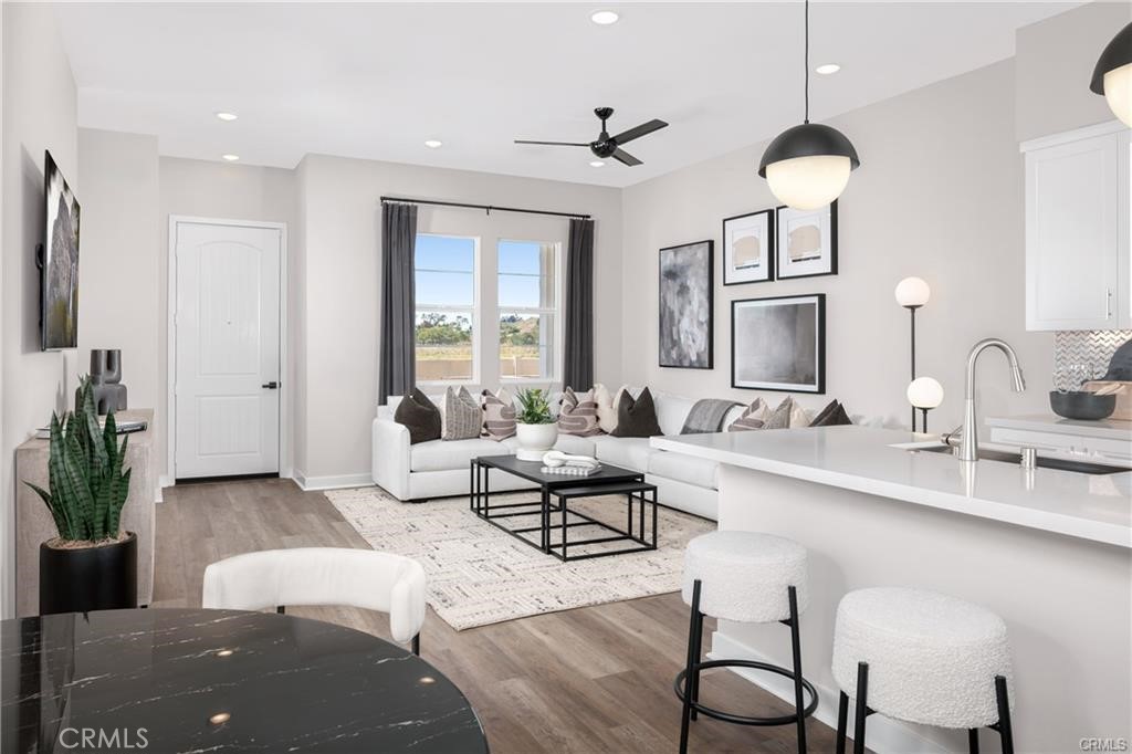 242 Solaro Court Walnut, CA 91789 - Photo 6 of 15 a living room with furniture potted plant and a chandelier