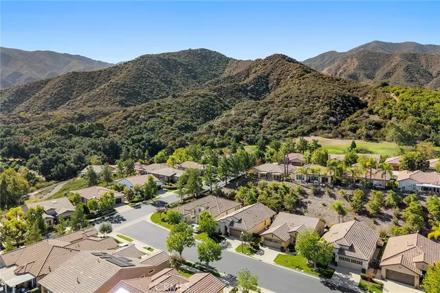 an aerial view of residential house and sandy dunes