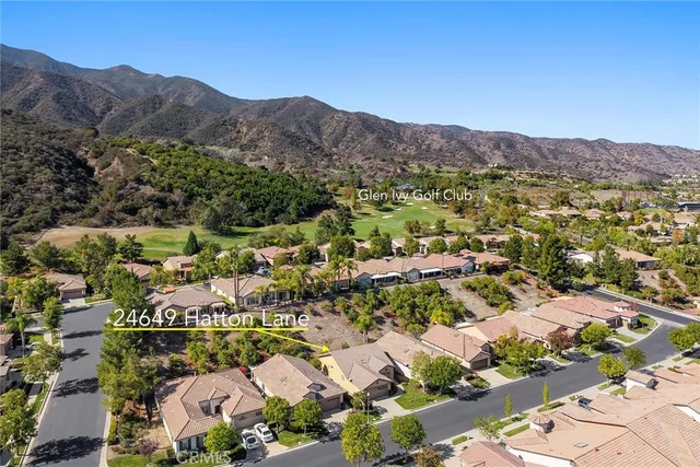 an aerial view of residential house and green space