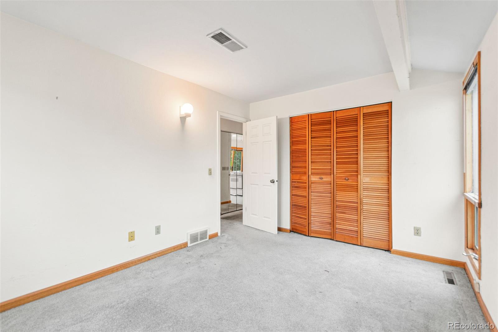 4814 West Moorhead Circle Boulder, CO 80305 - Photo 17 of 35 a view of an empty room with a window