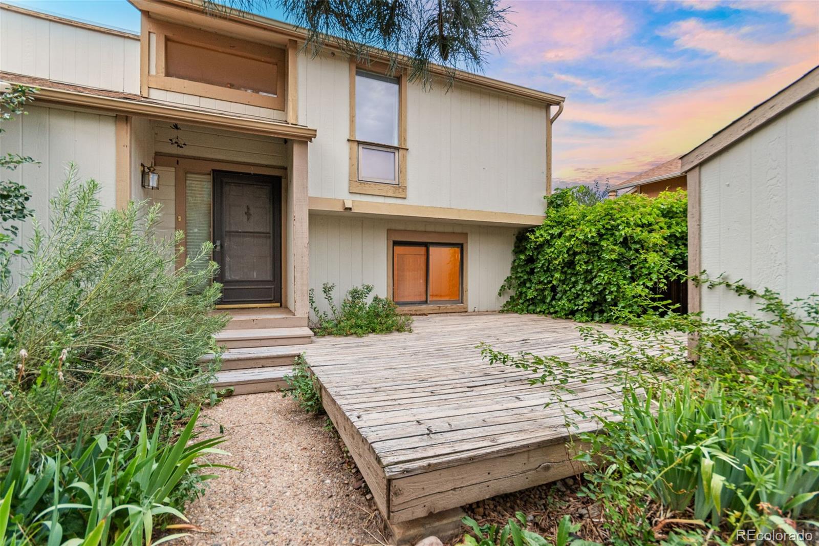 4814 West Moorhead Circle Boulder, CO 80305 - Photo 2 of 35 a view of a house with a yard and sitting area
