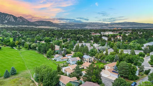 a view of a city with mountains in the background
