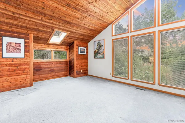 a view of an empty room with brick walls