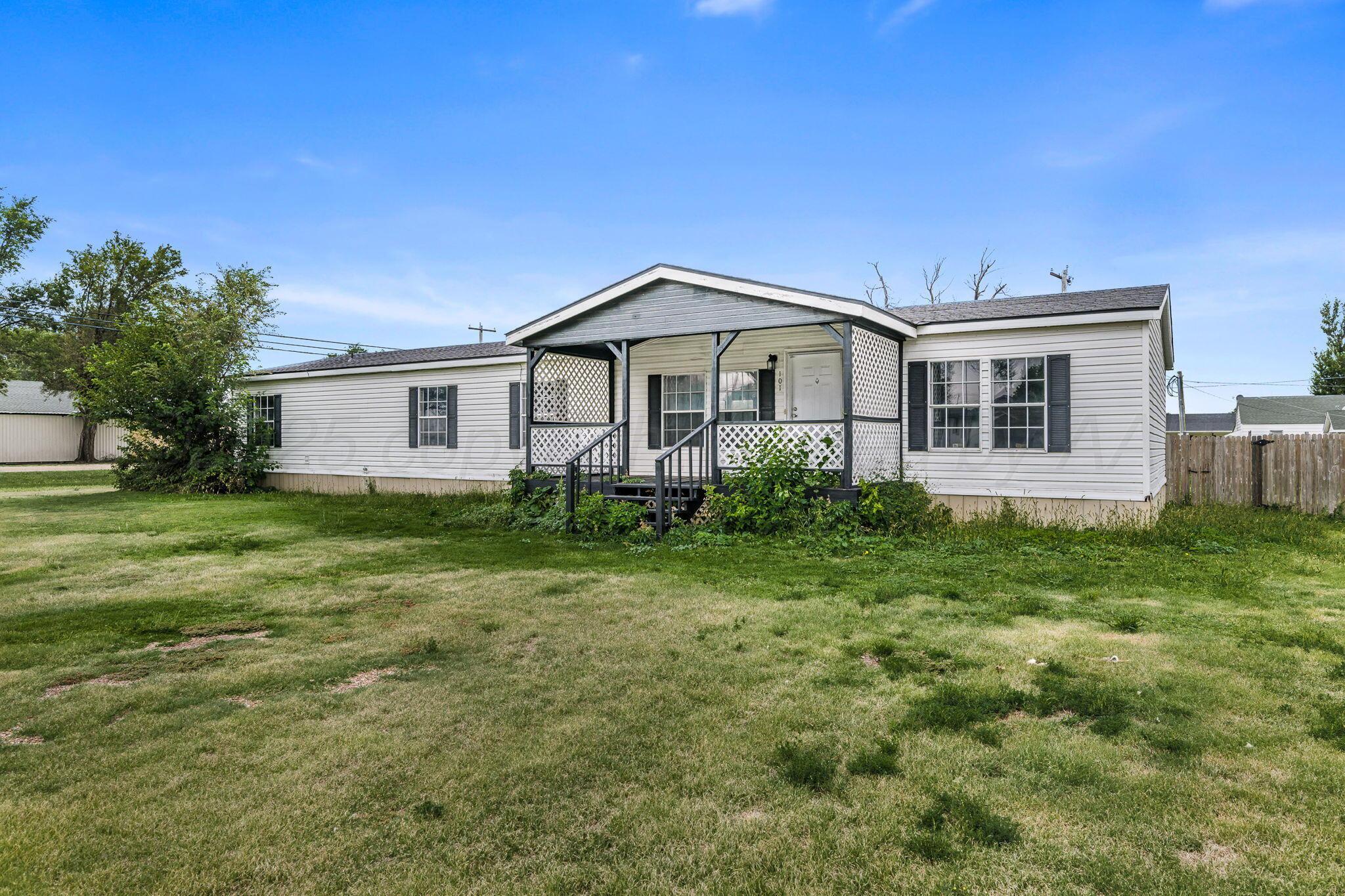 101 Collier Avenue Groom, TX 79039 - Photo 1 of 21 a big house with a big yard and large trees