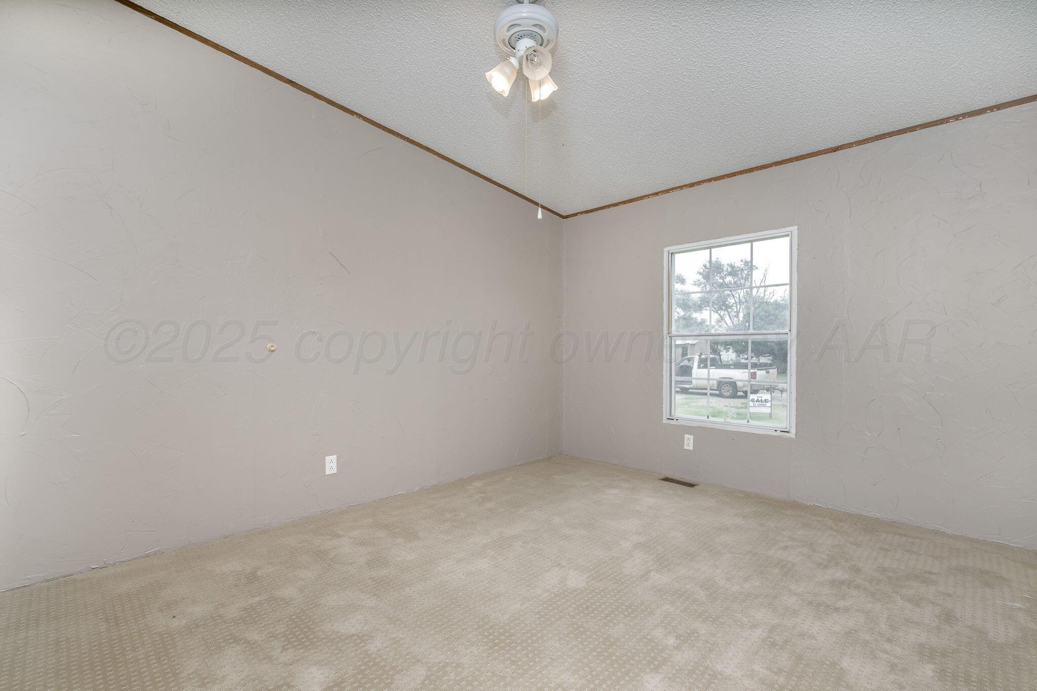 101 Collier Avenue Groom, TX 79039 - Photo 12 of 21 a view of an empty room with a window