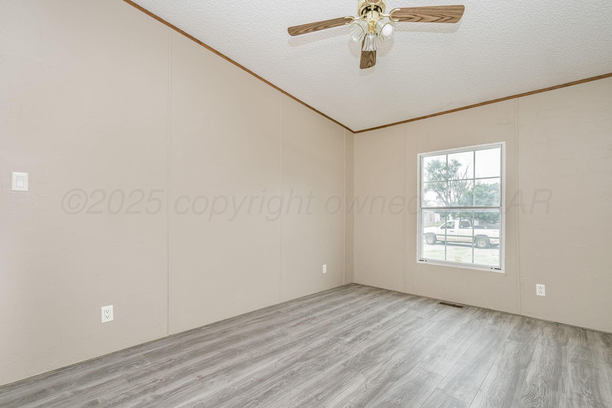 101 Collier Avenue Groom, TX 79039 - Photo 17 of 21 a view of an empty room with a window