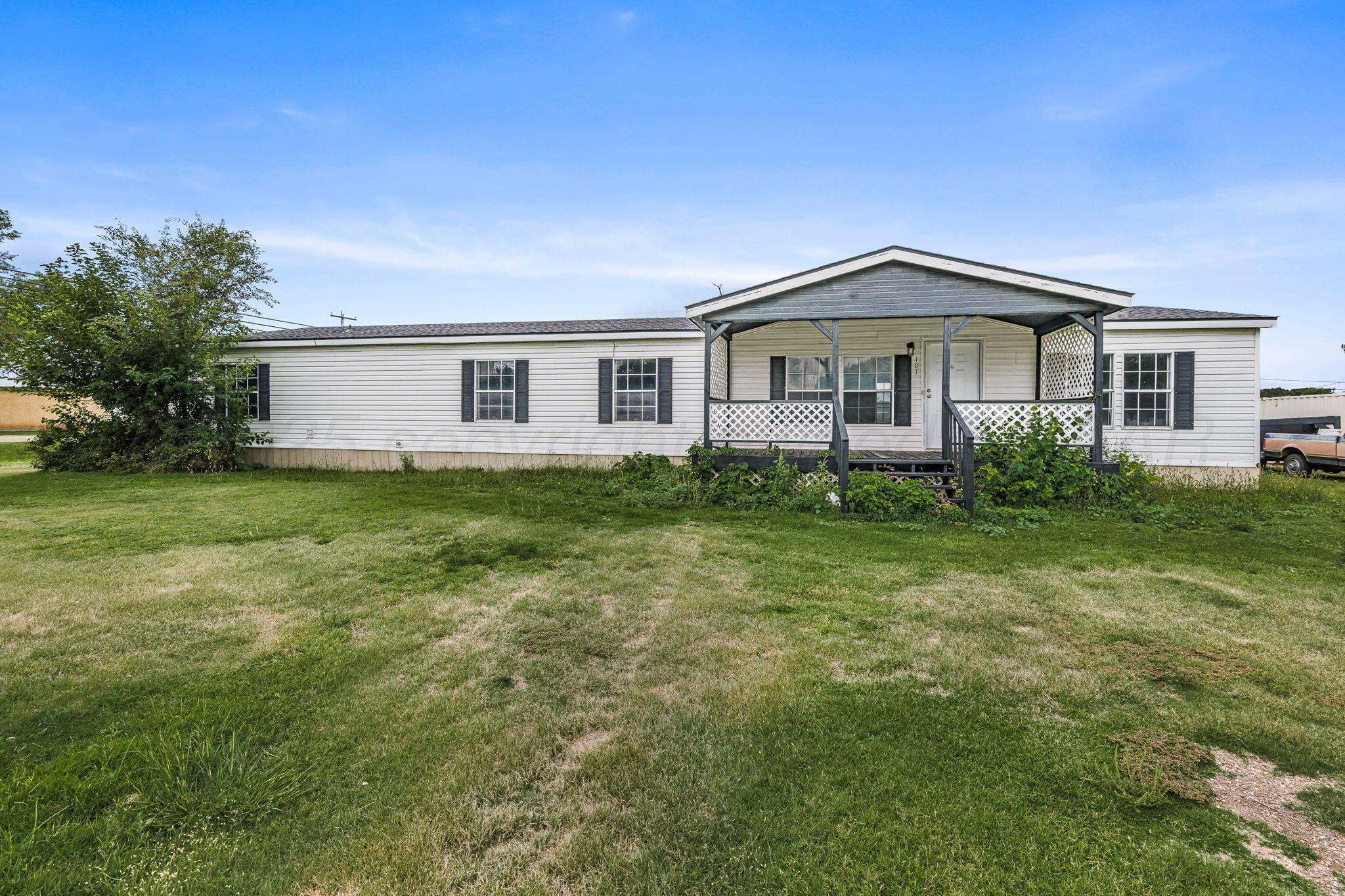 101 Collier Avenue Groom, TX 79039 - Photo 2 of 21 a front view of a house with a yard