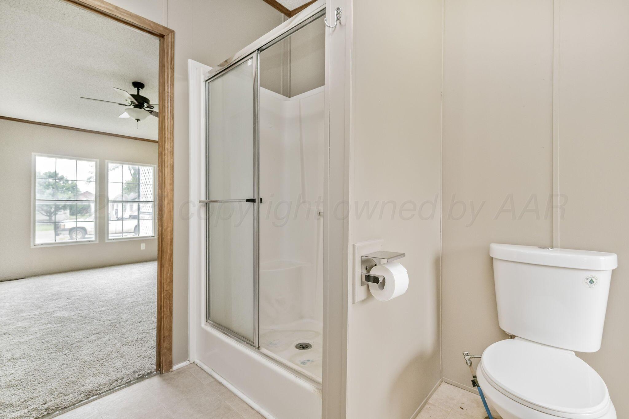 101 Collier Avenue Groom, TX 79039 - Photo 21 of 21 a bathroom with a toilet and a shower