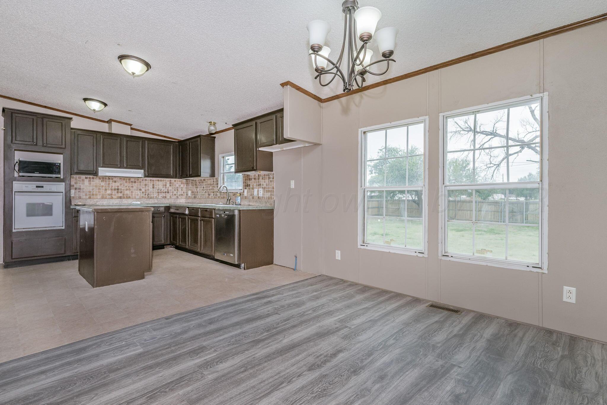 101 Collier Avenue Groom, TX 79039 - Photo 8 of 21 a view of kitchen with refrigerator stove and oven