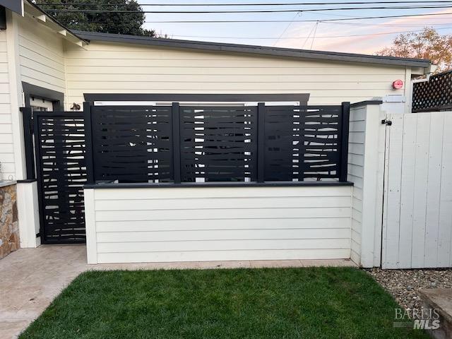 1016-1018 Spring Street Santa Rosa, CA 95404 - Photo 61 of 93 ADU - Gate and Privacy Screen from Patio Area - Sliding Door Access