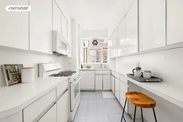 a bathroom with a granite countertop sink a toilet and a bathtub