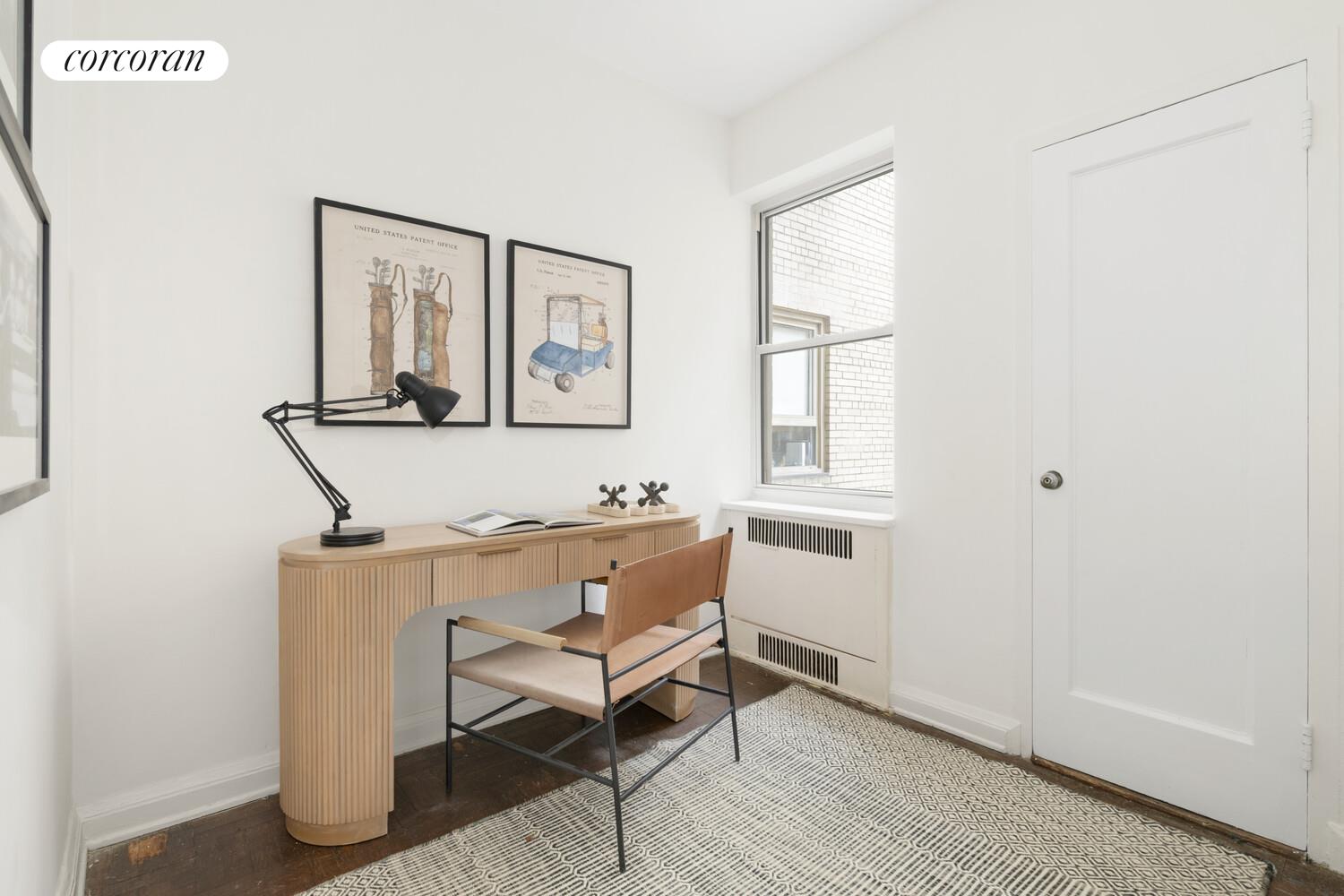 875 5th Avenue, Unit 15A Manhattan, NY 10065 - Photo 13 of 20 a room with chair and window