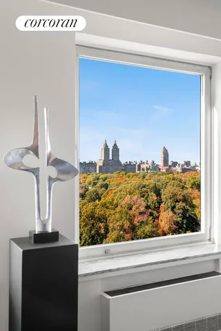 a living room with furniture a rug and a table