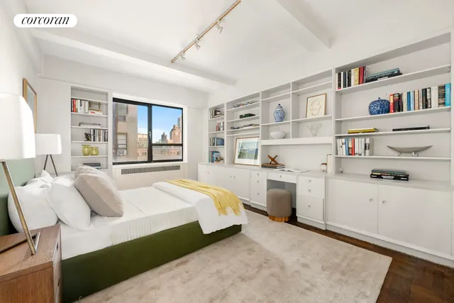 a bedroom with a bed and a couch