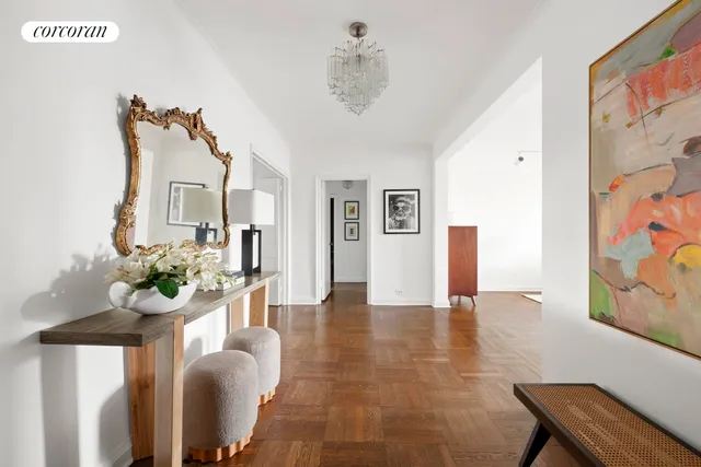 a bedroom with a bed cabinets and a window