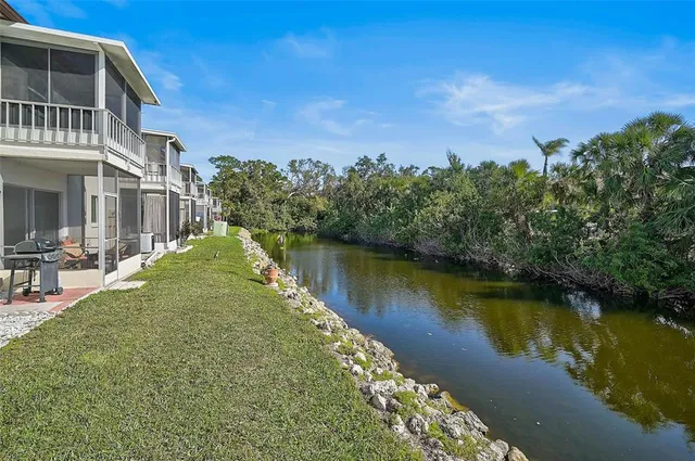 a view of a lake with a house in the background