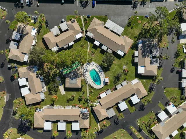 an aerial view of multiple houses with outdoor space
