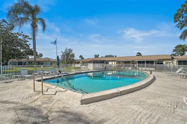 a view of a swimming pool with a lounge chair
