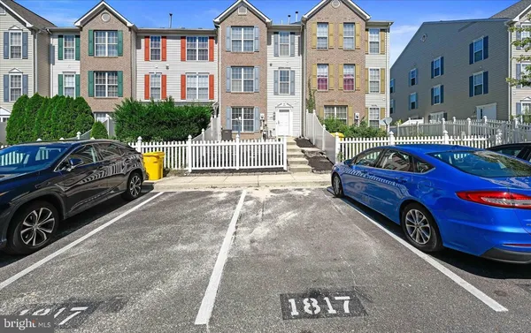 a view of a car parked in front of a building