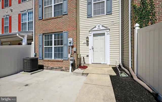 a view of a house with a door and a window