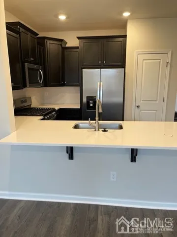 a bathroom with a sink and a large mirror