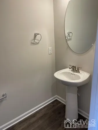 a bathroom with a sink and mirror