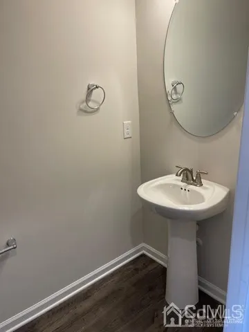 a bathroom with a sink and mirror
