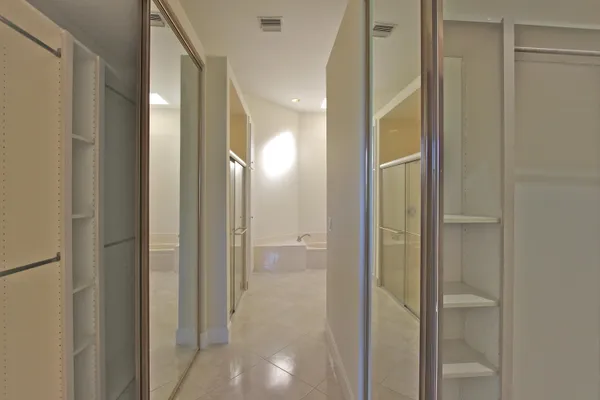 a bathroom with a double vanity sink toilet and shower