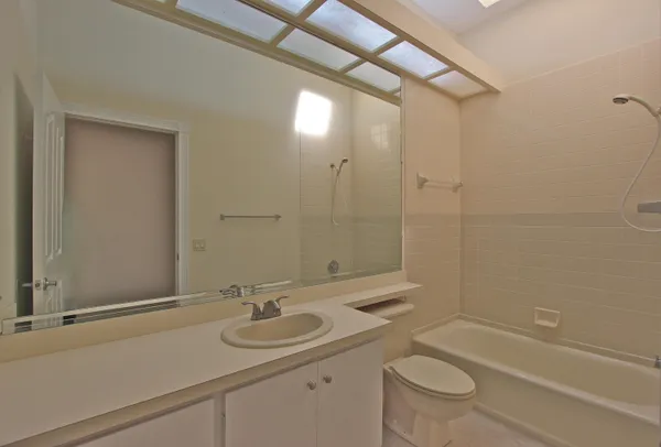 a bathroom with a sink and shower