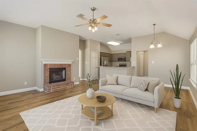 a living room with furniture and a fireplace
