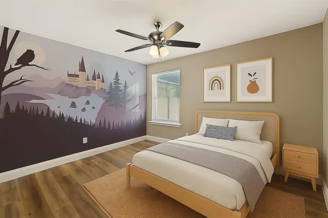 a bedroom with a large bed and a chandelier