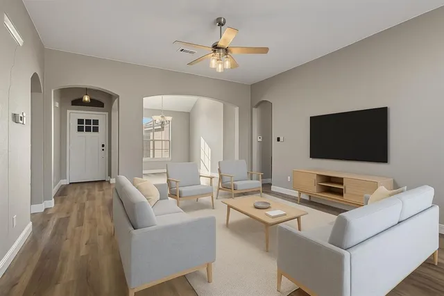 a living room with furniture and a flat screen tv