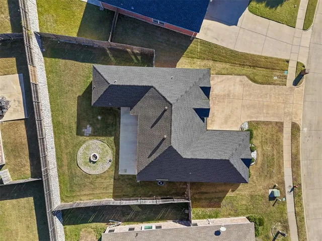 an aerial view of a house with swimming pool