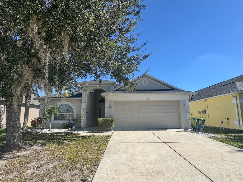 4150 Branchside Lane Wesley Chapel, FL 33543 - Photo 2 of 32 a front view of a house with garden
