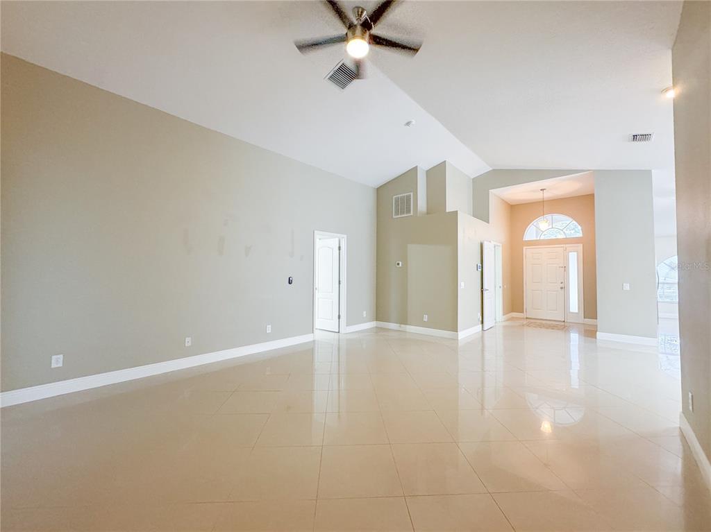 4150 Branchside Lane Wesley Chapel, FL 33543 - Photo 28 of 32 wooden floor in an empty room with a window