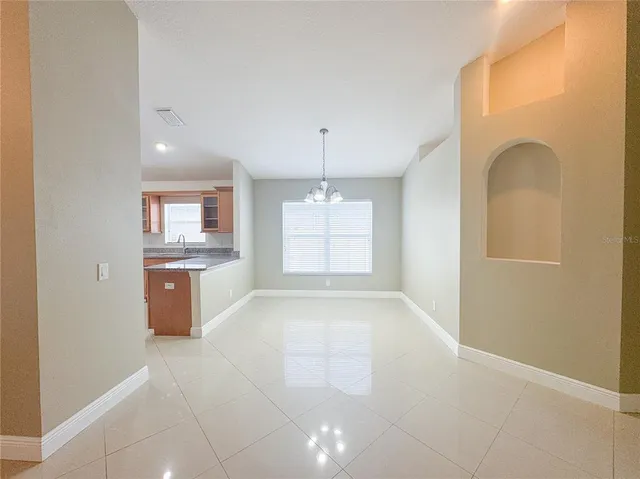 a view of a kitchen with a refrigerator a sink a dishwasher and a refrigerator