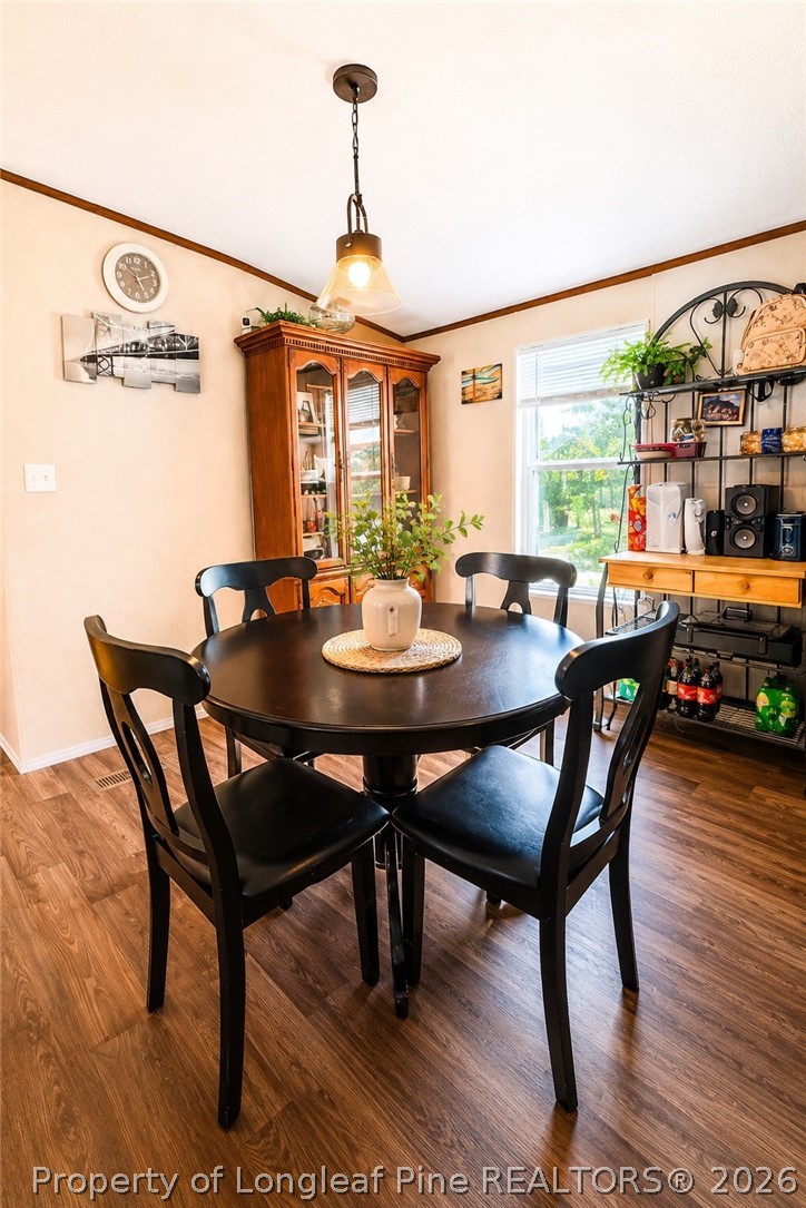 466 Ralph Hunt Boulevard Orrum, NC 28369 - Photo 4 of 17 a view of a dining room with furniture window and outside view