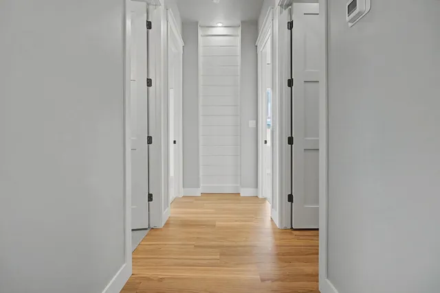 a spacious bathroom with a double vanity sink a mirror and shower