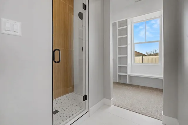 a bathroom with a bathtub and a toilet