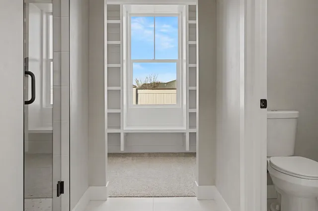 a bathroom with a double vanity sink mirror and