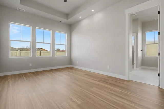 a bedroom with a bed and a potted plant