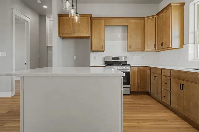 a kitchen with cabinets a sink and appliances