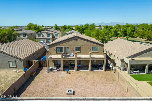 a aerial view of a house with a yard