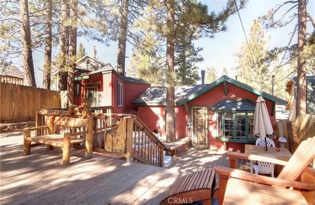 front view of a house with a wooden fence