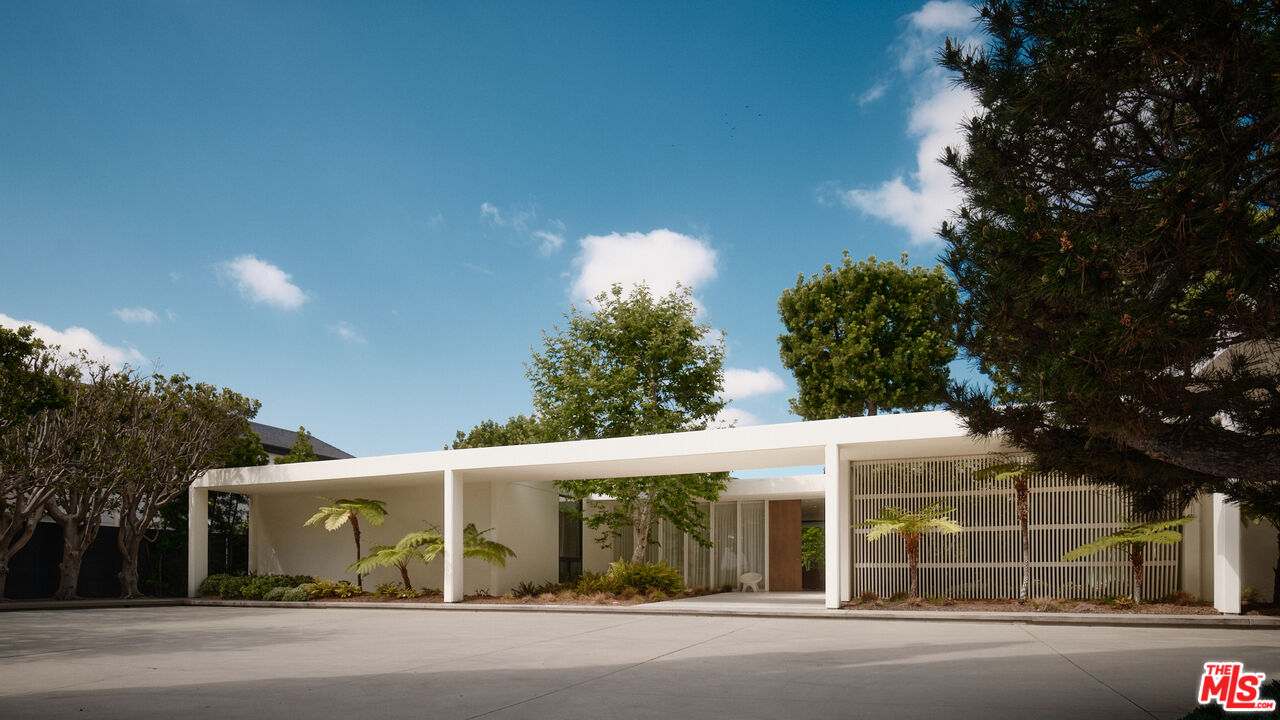 713 North Hillcrest Road Beverly Hills, CA 90210 - Photo 2 of 28 front view of a house with a street