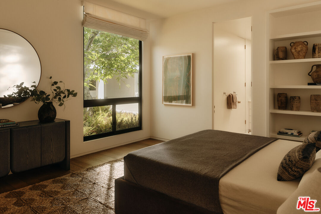 713 North Hillcrest Road Beverly Hills, CA 90210 - Photo 24 of 28 a bedroom with a bed and a window