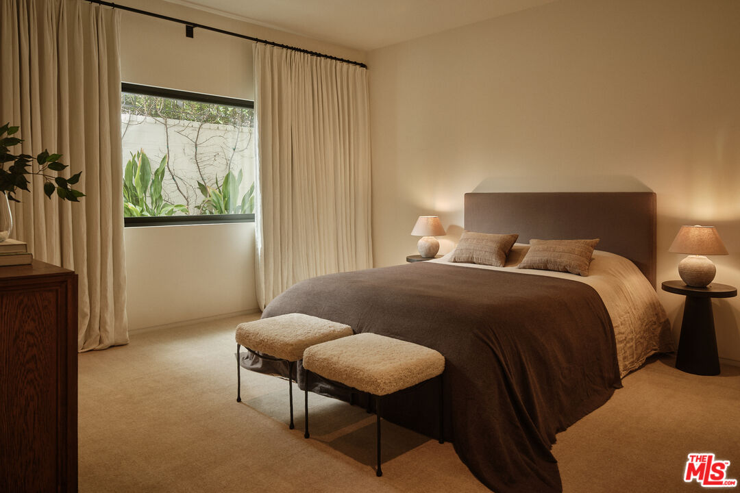 713 North Hillcrest Road Beverly Hills, CA 90210 - Photo 25 of 28 a bedroom with a bed and a window