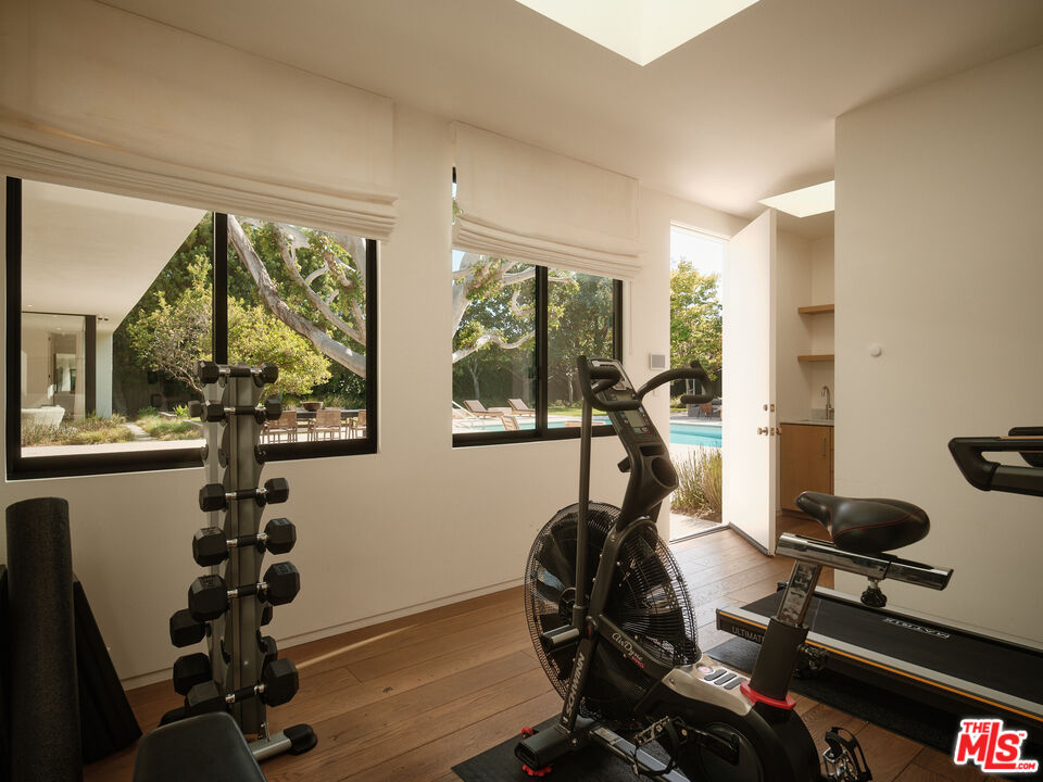713 North Hillcrest Road Beverly Hills, CA 90210 - Photo 26 of 28 a view of a room with gym equipment