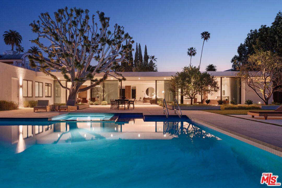 713 North Hillcrest Road Beverly Hills, CA 90210 - Photo 28 of 28 a view of a swimming pool with a patio